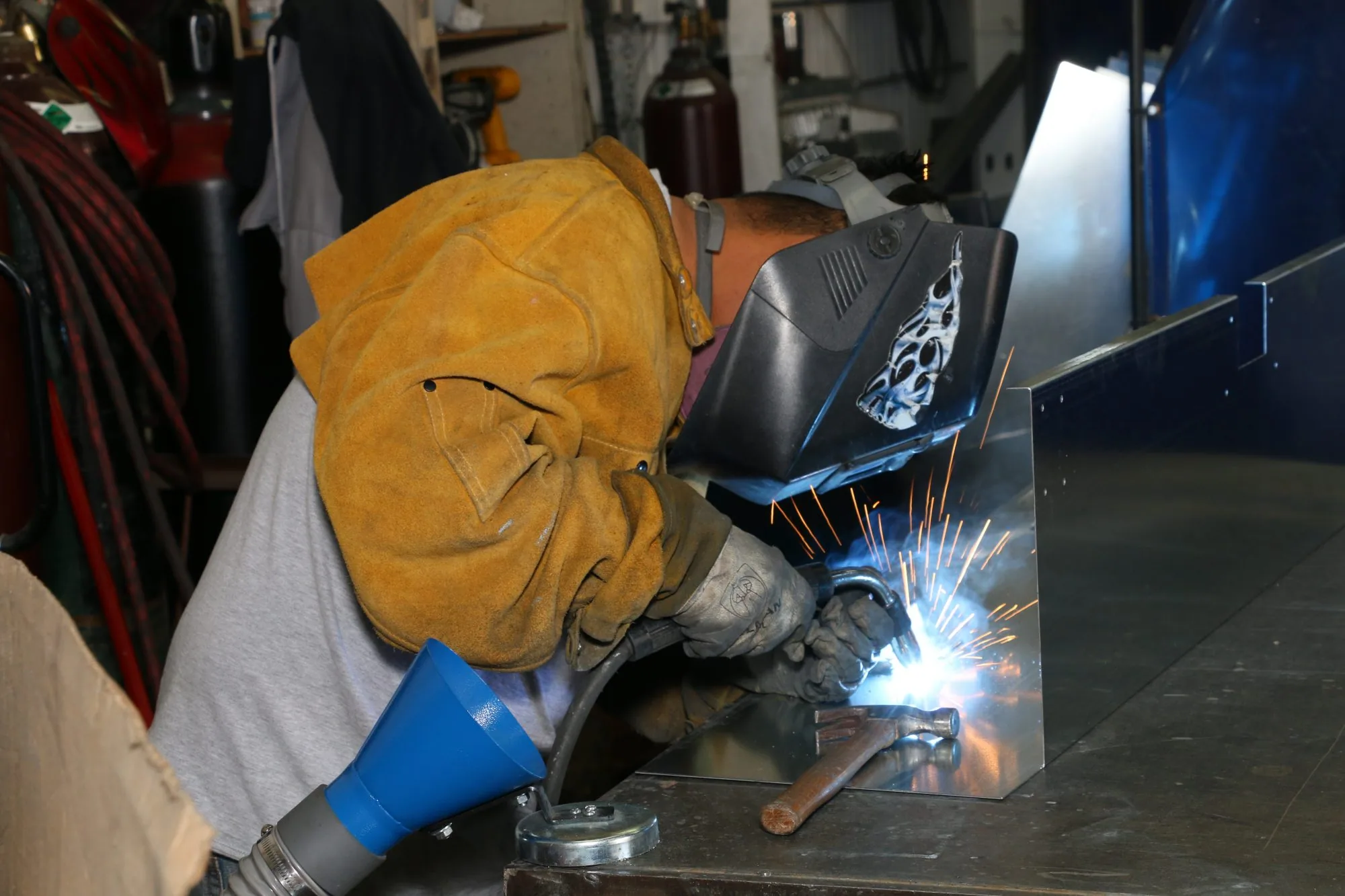 Welder joining a fabricated steel assembly