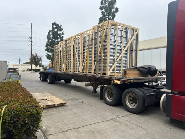 Crated custom roof curbs loaded on a flatbed truck