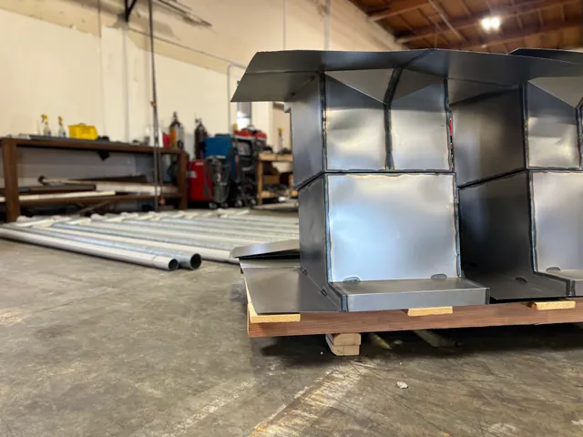 Hooded roof curb on a pallet in the fabrication shop